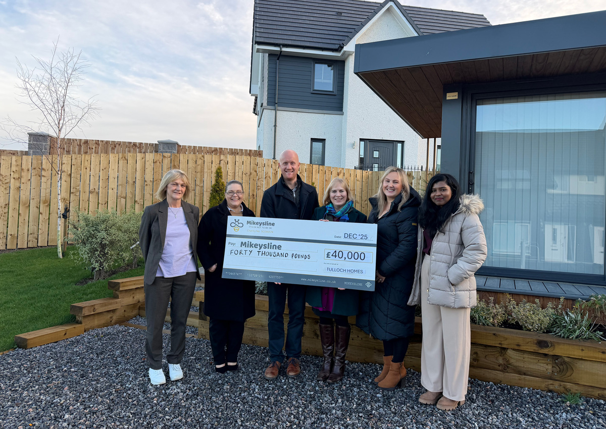 (L-R) Alison Mackenzie, Administrative Co-ordinator at Tulloch Homes, Laura Griffiths, HR Advisor at Tulloch Homes, Kieran Graham, Managing Director at Tulloch Homes, Emily Stokes, CEO of Mikeysline, Helen Robertson, Marketing Assistant at Tulloch Homes and Jonisha Johnson, HR Assistant at Tulloch Homes. The cheque for £40,000 is being presented to Emily by the Tulloch Homes team at the Fairview Heights development in Inverness.